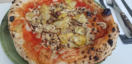Pizza with mushrooms customized removing cheese and adding artichokes. at Pizzeria To je To in Istarska županija