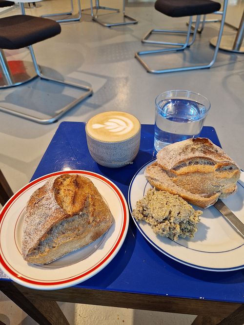 Delicious sourdough rolls with artichokespread. And a great cafe latte with plant milk. at Brandt Brød in Silkeborg