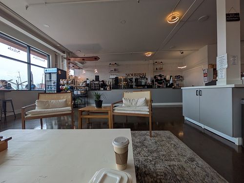 One side of the cafe, facing the order station. Coffee bar (free refills!) is to the right, lots more seating, games, books, and coloring behind me and to the right. at Maydan Cafe in Baldwinsville