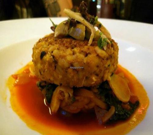 moroccan spiced chickpea cake: seasonal vegetables, red pepper-coconut curry, ginger-apricot-date chutney, toasted almonds at Candle 79 in New York City