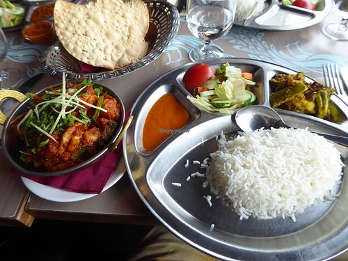 Overall plating with rice, sides and bread at Ravintola Mayur in Uusimaa