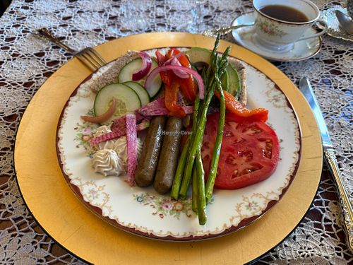 Vegan breakfast with fresh baked bread, homemade vegan cashew spread, roasted veggies, and vegan sausage. (Not pictured: fresh squeezed juice and vegan chocolate chip oat cookie) at Buffalo Harmony House in New York