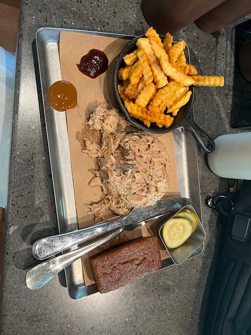 Unsauced jackfruit with vegan fries. Bread served is not vegan (per menu). Sauces said to be all vegan   at Café L’air De La Sirène™ in Orlando