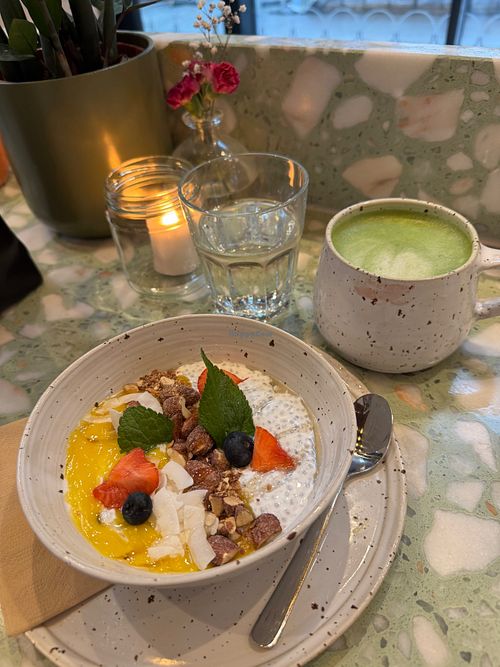 Tropical chia pudding with an oat milk matcha latte at BodyBuddy Café Masthuggskajen in Västra Götalands Län