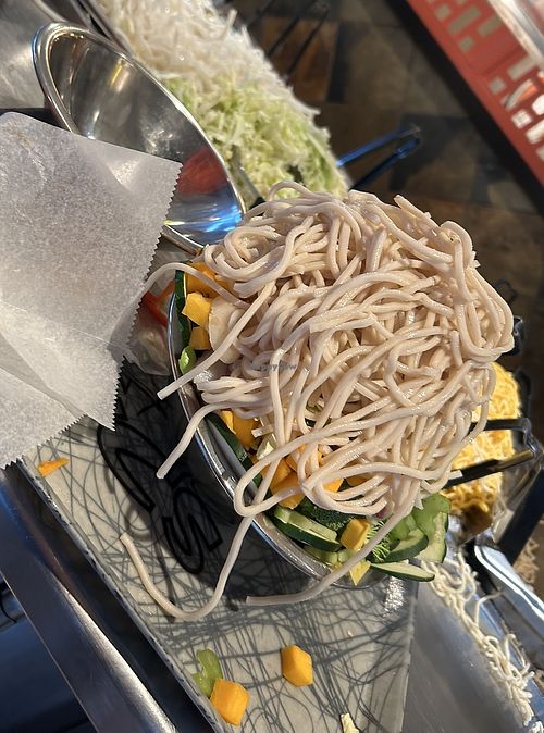 A whole bowl of veggies with noodles piled on top  at YC's Mongolian Grill in Gilbert