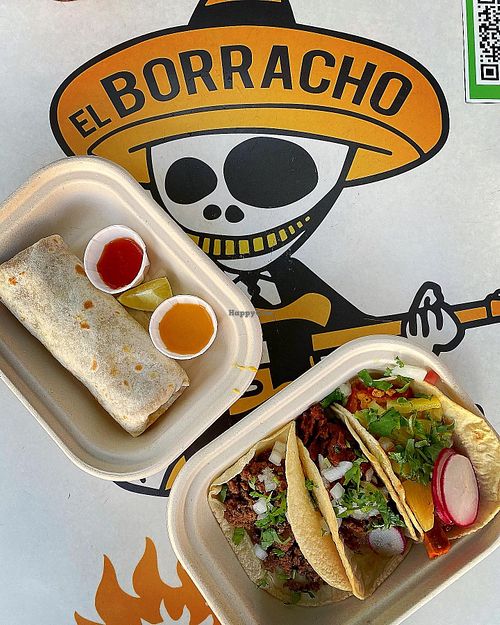 Shorty burrito and array of nachos at El Borracho - Pike Place Market in Seattle
