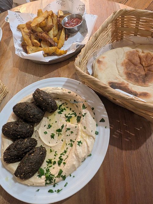 Hummus plate + falafel, pita and side of french fries at Sababa Restaurant in Sololá