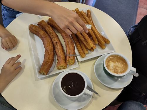 Chocolate vegano con churros at Chocolatería Cortes de Aragón in Aragón