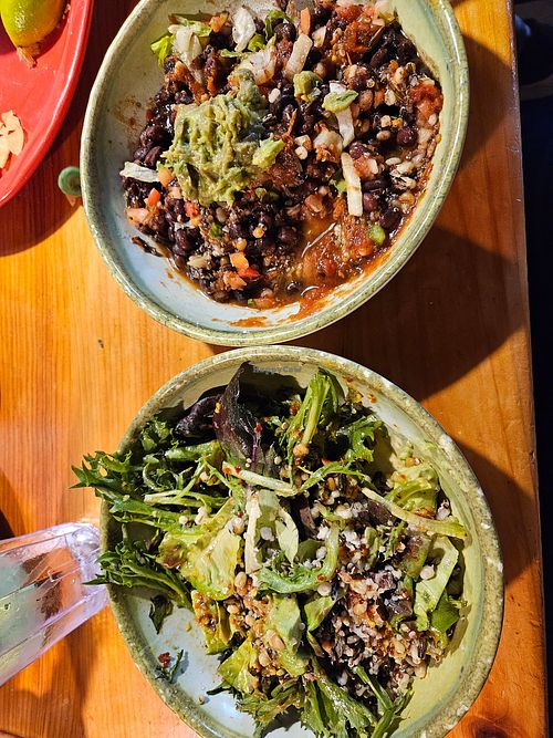 Mayan Salad (L) and black bena burrito bowl (R) at Red Mesa Grill - Traverse City in Traverse City