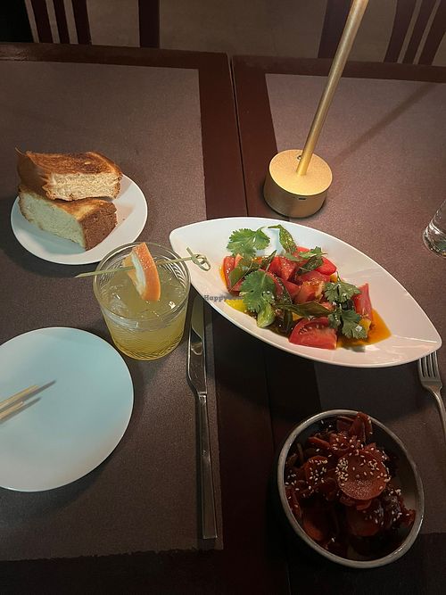 Tomato salad, Hawaiian bread, lucky god pickles and a mocktail    at Vintage Books in Honolulu