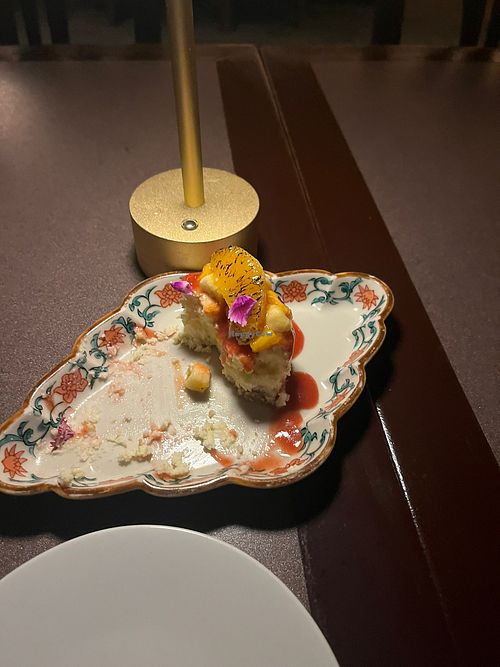 Vegan cheesecake topped with fresh tropical fruits    at Vintage Books in Honolulu