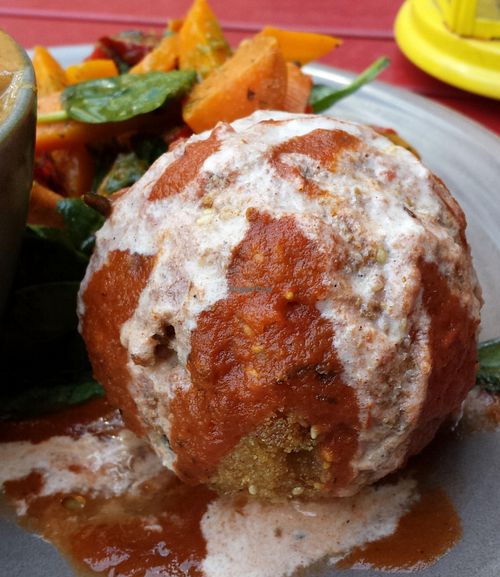 Vegan aranchini ball with tomato sauce and tahini.  at Radhey Chai Bar in Fitzroy