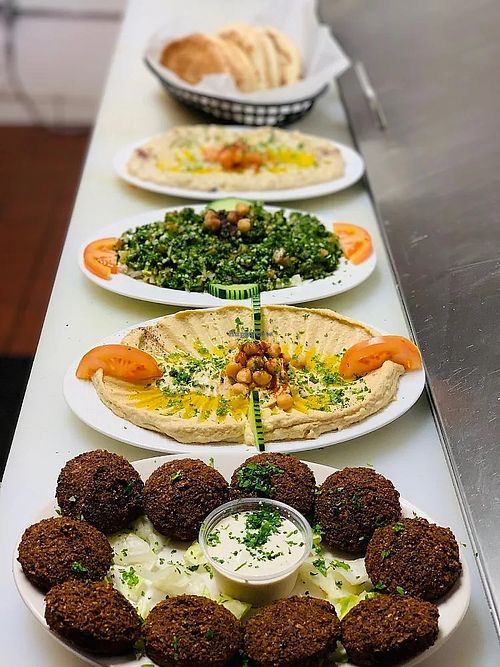 Hummus, tabouli salad, baba ghaouj, pita bread at Al Madina Restaurant in Rochester