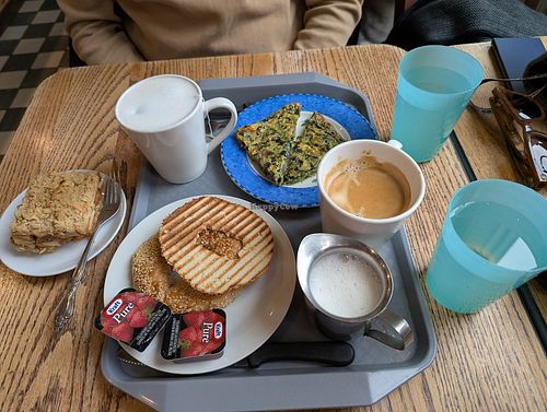Vegan Apple crumble, oat milk coffee and bagel with Jam. at Au Grain de Café in Montreal