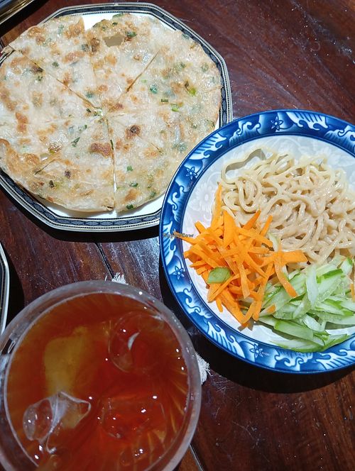 Sesame sauce noodles and onion pancake at Baansuan Sudawan in Bangkok