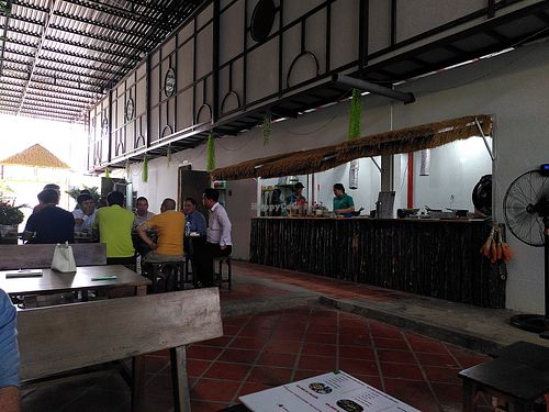 Kitchen and sitting area at TIỆM CƠM VỊ NHÀ - PHAN THIẾT in Bình Thuận