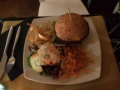 vegan burger with veggie chips and salad at DosTrece in Barcelona