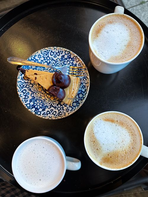 Salted caramel chocolate cake, out lattes and an oat babyccinoo  at Coffeelogy in England