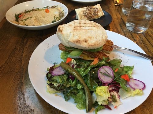 BLTA Sandwich with Flatbread and Hummus in the background. at Mesa Verde in Santa Barbara