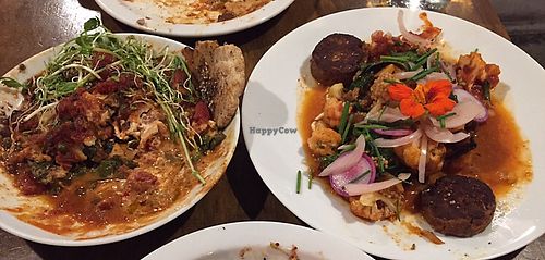 Amazing vegan cashew lasagne to the left with zaatar flatbread / more ordinary harissa cauliflower to the right  at Mesa Verde in Santa Barbara