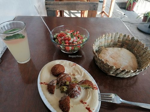 Hummus with falafel, bread and Arabic salad at Kufiyyeh Arabic Restaurant in Yucatán