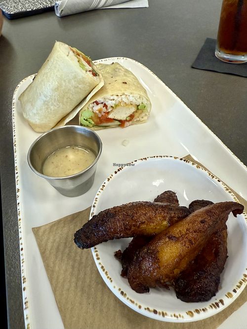 Tofu burrito, “veg-y style” + side of plantains  at The Burrow Food & Bar in Marco Island