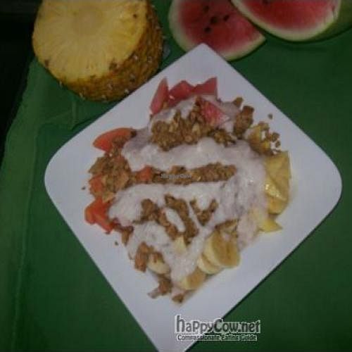 Fruit salad with raw granola and coconutcream at Veronica's Place in Puerto Viejo De Talamanca