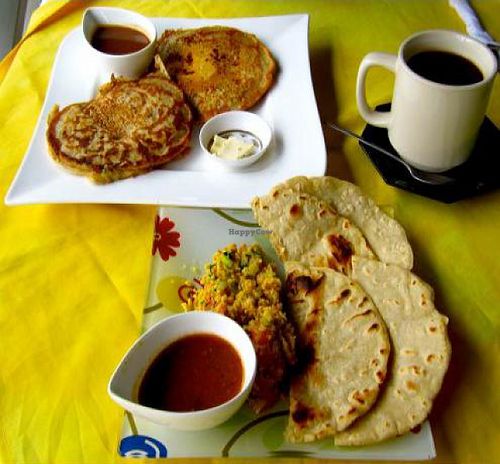 delicious organic vegan breakfast! banana pancakes with fruit syrup and soy butter, and tortillas with scrambled tofu, a black coffee.  at Veronica's Place in Puerto Viejo De Talamanca