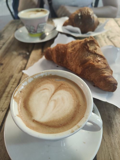 Soy cappuccino and apricot jam croissant at Caffe Trastevere in Rome