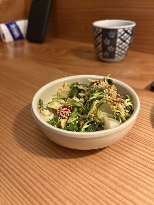 Tasty salad with Brussels sprouts   at Slurp Ramen Joint in København