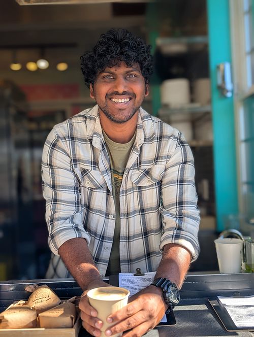 Owner Praveen serving their delicious Cacao + espresso at Fika in Victoria