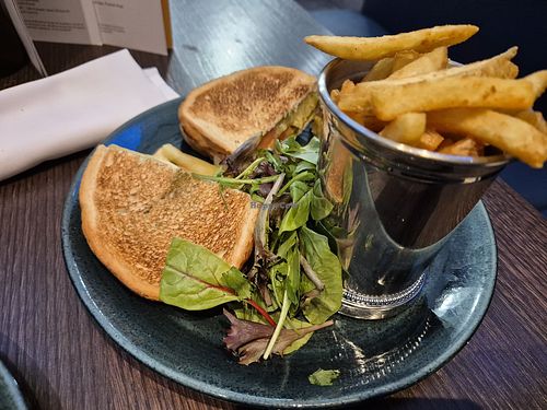Cheese, pesto and tomato toastie, made VG (third toastie hiding behind the fries, decent portion) at Voco Reading by IHG in Berkshire