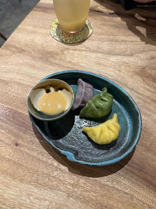 Rainbow gyoza (purple yam, spinach, pumpkin) with yuzu miso saucee  at KOKU Vegan Ramen Kyoto in Kyoto