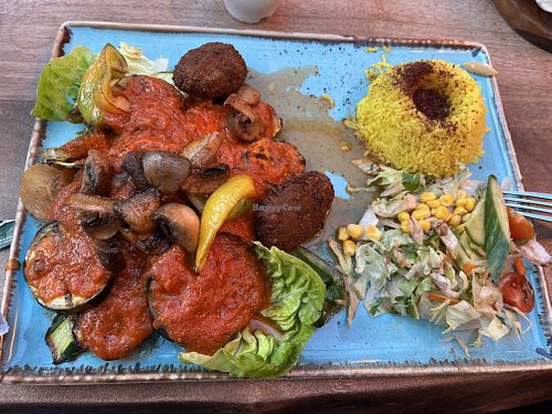 Grilled vegetables with tomato sauce, with falafel, mushrooms, green beans & spiced  rice,   at Olive & Thyme in Manchester