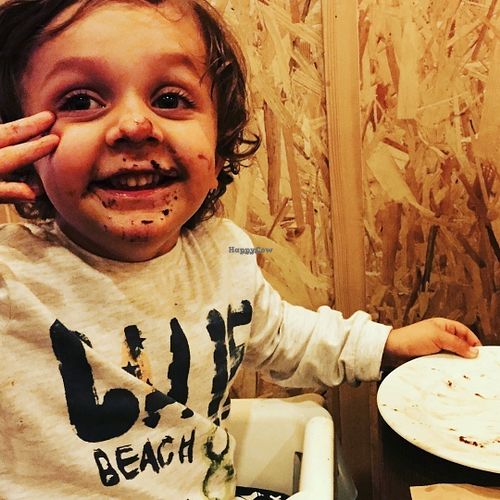 Happy child after vegan gluten free chocolate cake! at Bioveggy in Florence