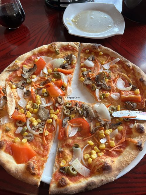 Veggie pizza without cheese. The crust is amazing and the toppings good.  at Golden Flower in Tornio