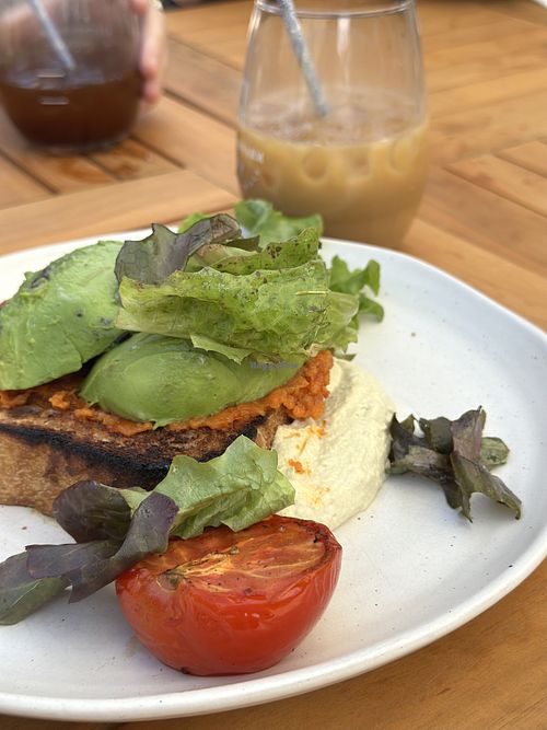January 2026: avocado, semi dried tomato 'nduja' toast, slow roast tomato, whipped sunflower seed vegan ricotta, farm leaves  at Kitchen Farm Pantry in Mount Barker