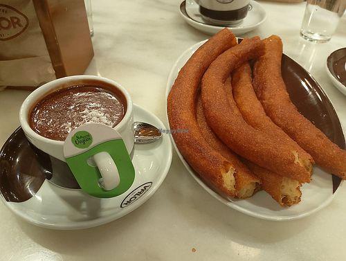 Chocolate con bebida vegetal y churros at Chocolatería Valor Bilbao in Euskadi