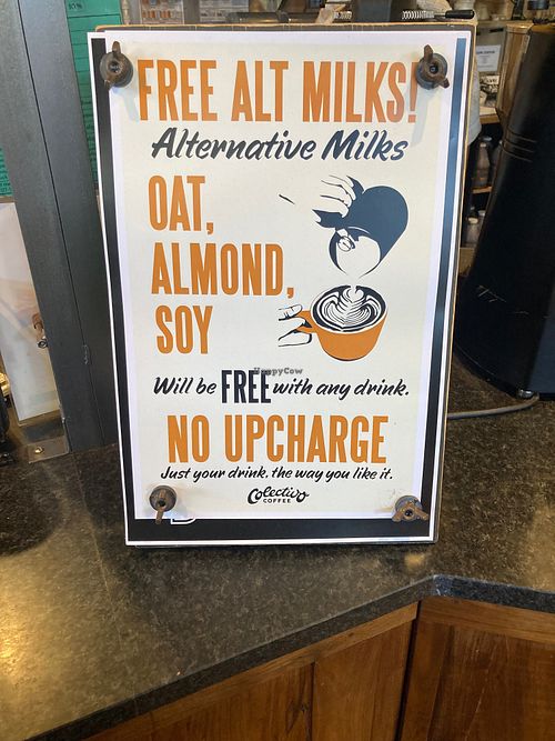 Placard in store: no vegan surcharge for plant milk! at Colectivo Coffee Evanston in Evanston