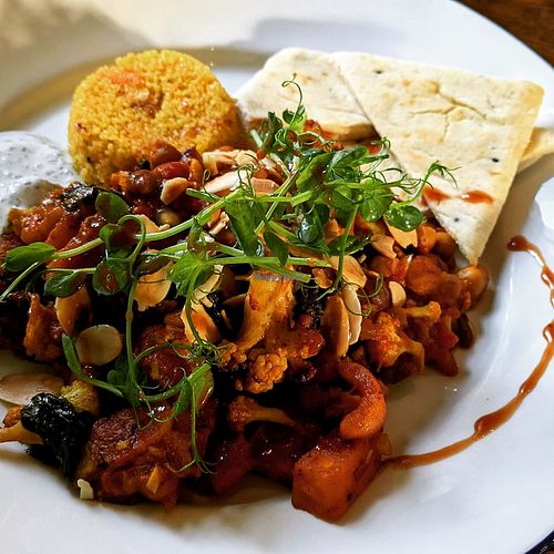 Cauliflower tagine with mint yogurt and couscous at The Clog & Billycock in Blackburn