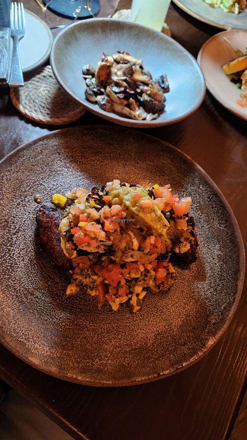 Smothered cauliflower steak with side of roasted mushrooms! at The Easterly in East End
