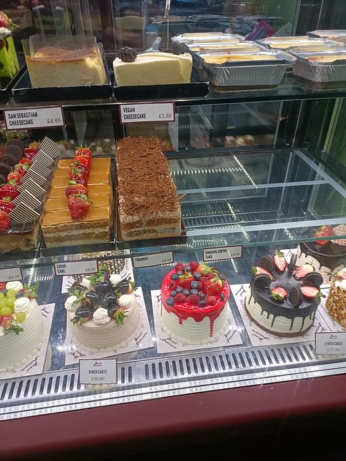 Cake display from outside at Bravo Patisserie in Brighton