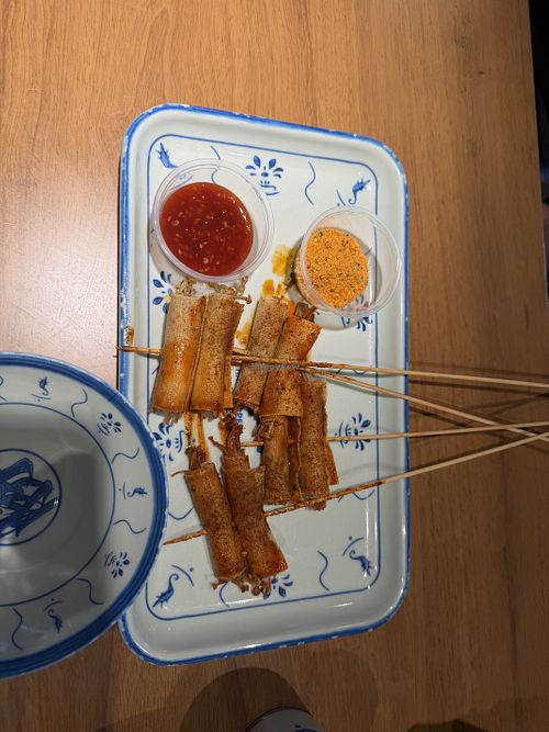 Enoki mushroom skewers with tofu skin   at SLAP Hand Ripped Noodles in Orlando