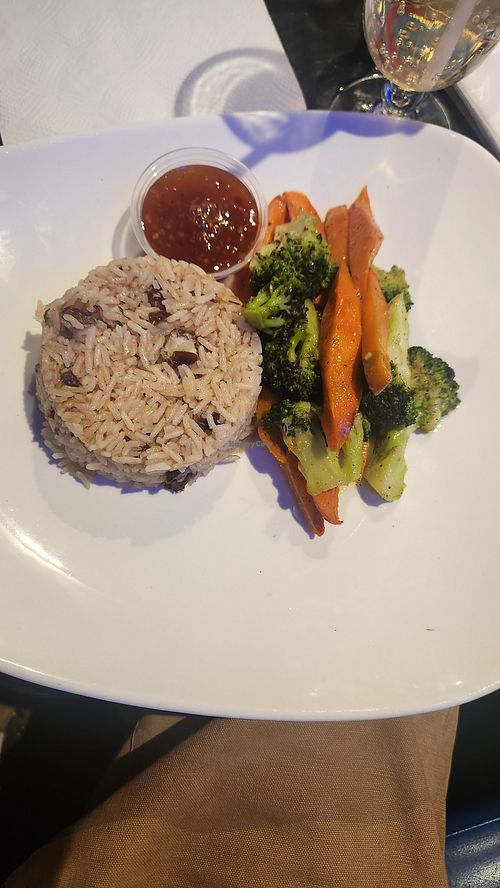 Jasmine coconut rice and peas with side of sautéed vegetables with tamarind sauce on the side. at Drift BK Restaurant & Lounge in New York City