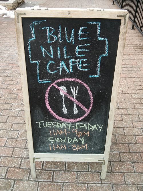 Outside sign from a few years ago...double check the hours! at Blue Nile Cafe in Kansas City