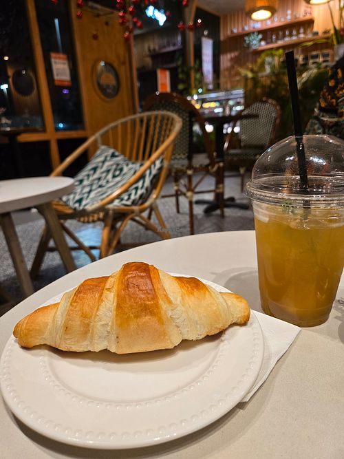 Vegan croissant and lychee jasmine tea at The Artisan 360 in Houston