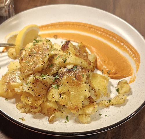 Crispy potatoes (vegan option substitutes duck fat, omits parm) at Ursa Kitchen in Mammoth Lakes