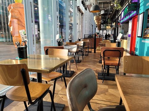 Indoor seating at Farm Girl Paddington - Market Halls in London