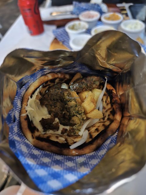 This is the best falafel pita I've had in my life. And y'all know, after being vegan for almost 6 years, veg for 2 more before that, I've had a lot of these. So delicious. at Fetta's Greek Taverna in Cairns