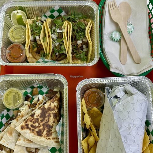 Clockwise from Top Left: Taco Trio (Impossible Chorizo, Birria Mushrooms, Carne Asada), Burrito Sr (Impossible Chorizo), Flour Quesadilla (Seitan Carnitas) at Taqueria Vegana in Toronto